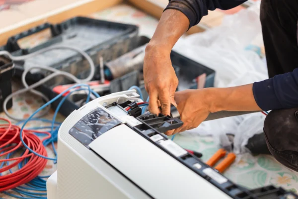 Technician repairing the internal components of a split air conditioner